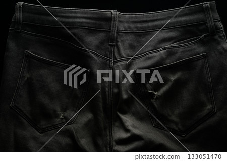 Black jeans with holes in the pockets Black jeans with holes in the pockets 133051470