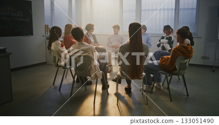 Group of Students Participates in Classroom Talk on Mental Health Guided by Compassionate Teacher 133051490