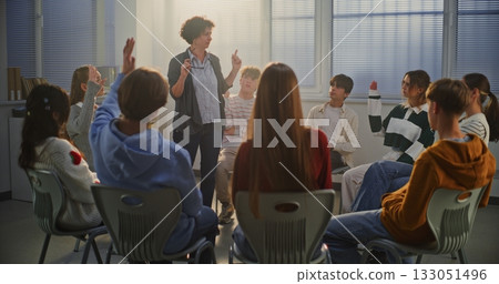 Female Teacher Guides Teenage Girl in Center of Circle Through Emotional Improvisation Exercise 133051496