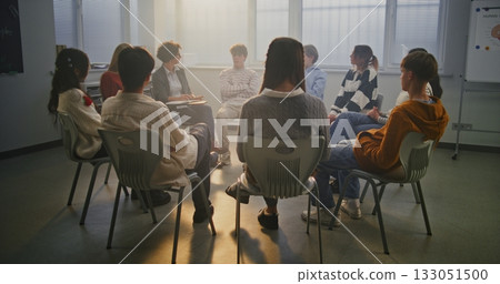 Woman Encourages Pupils Share Feelings in Safe, Supportive Classroom Environment Woman Encourages Pupils Share Feelings in Safe, Supportive Classroom Environment 133051500