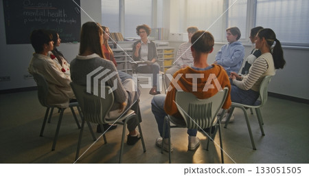 Woman Encourages Pupils Share Feelings in Safe, Supportive Classroom Environment Woman Encourages Pupils Share Feelings in Safe, Supportive Classroom Environment 133051505