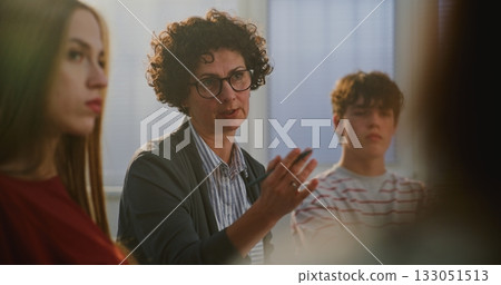 Teacher Encourages Teenage Students Express Emotions and Thoughts During Mental Health Discussion Teacher Encourages Teenage Students Express Emotions and Thoughts During Mental Health Discussion 133051513