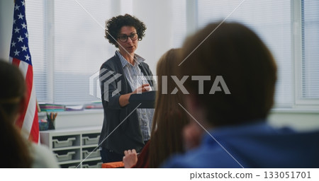 Enthusiastic American Teacher Explains Concept Students During Interactive Classroom Discussion 133051701