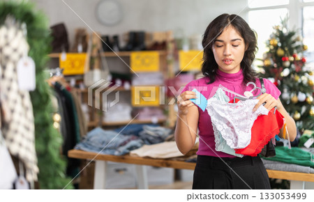 Asian woman buys panty sets on Christmas sale 133053499