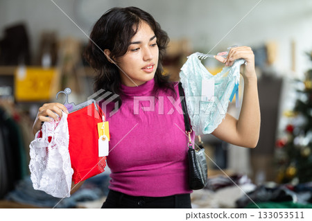 Asian woman buys panty sets on Christmas sale Asian woman buys panty sets on Christmas sale 133053511