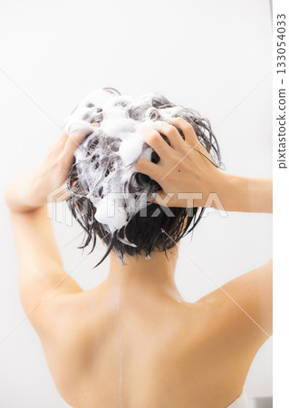 A woman taking a bath A woman taking a bath 133054033