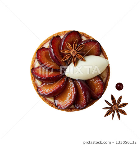 Delicious gourmet plum tart dessert with roasted fruit and star anise. Sweet pastry food topped with quenelle of cream 133056132
