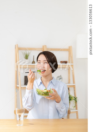 Woman eating salad Woman eating salad 133056613