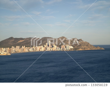 resort evening scene, calm ocean backdrop with twilight glow and inviting resort atmosphere 133058119