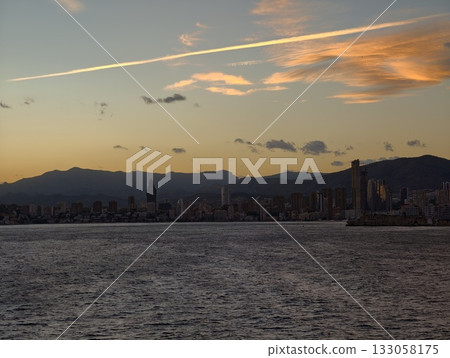 dusk skyline with clouds, peaceful sunset scene featuring distant ridgelines and gentle seascape dusk skyline with clouds, peaceful sunset scene featuring distant ridgelines and gentle seascape 133058175