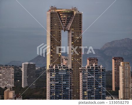skyline towers glow, elegant urban residential structures, illuminated towers with bridging 133058270