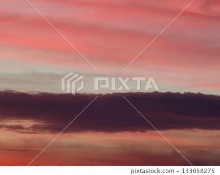 serene sunset sky with flowing clouds and subtle gradients casting quietness over distant ocean serene sunset sky with flowing clouds and subtle gradients casting quietness over distant ocean 133058275