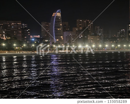 city lights reflecting, serene city harbor scene with glowing skyscrapers and shimmering reflections city lights reflecting, serene city harbor scene with glowing skyscrapers and shimmering reflections 133058289