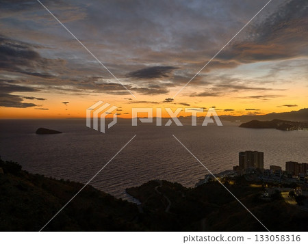 evening scene with peaceful water and vessels, tranquil coastal bay during twilight with moving evening scene with peaceful water and vessels, tranquil coastal bay during twilight with moving 133058316