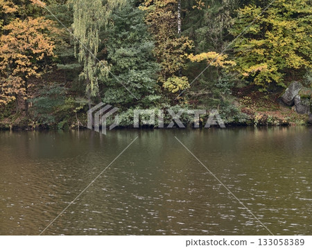 private nature sanctuary, secluded lakeside refuge surrounded by colorful foliage and peaceful private nature sanctuary, secluded lakeside refuge surrounded by colorful foliage and peaceful 133058389