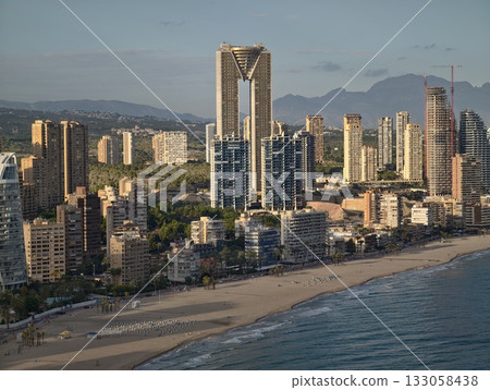 sunrise cityscape with waterfront activity, morning aerial view of urban harbor and skyscrapers sunrise cityscape with waterfront activity, morning aerial view of urban harbor and skyscrapers 133058438