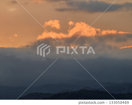 sunset cloud display, vivid sunsetlit cloud formation showcasing dramatic colors and vast horizon sunset cloud display, vivid sunsetlit cloud formation showcasing dramatic colors and vast horizon 133058489