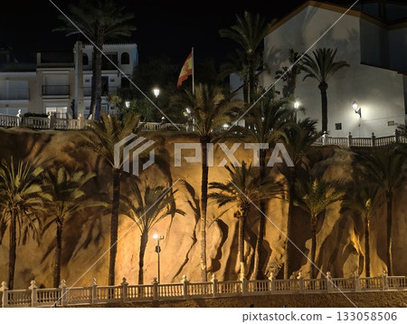 serene seaside walkway, evening walk along serene cliffside adorned with palms and warm glowing serene seaside walkway, evening walk along serene cliffside adorned with palms and warm glowing 133058506