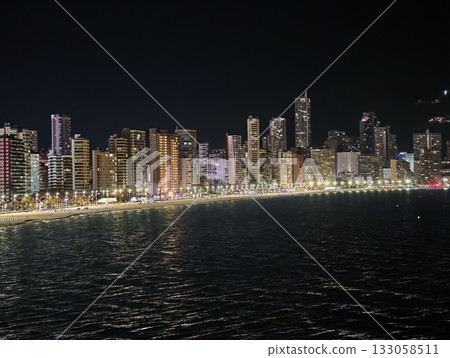 night skyline glow, serene cityscape at night with sparkling reflections and peaceful environment night skyline glow, serene cityscape at night with sparkling reflections and peaceful environment 133058511