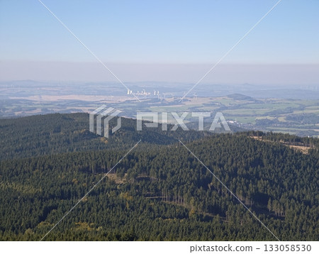 remote monitoring of landscape, wide view of valley and surrounding industrial landscape at dusk 133058530