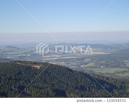 unending landscape with distant horizons, expansive view showcasing rolling fields and lush hills 133058531