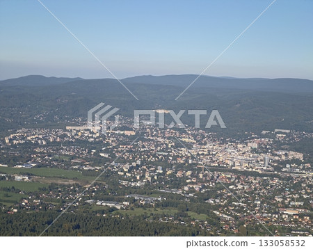 aerial view of hillside settlement, detailed aerial perspective of hilltop community surrounded 133058532