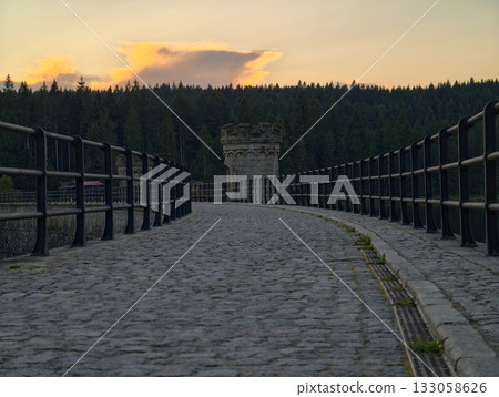 sunset illuminates textured footpath, golden sunset bathes stonebuilt pathway with inviting warmth sunset illuminates textured footpath, golden sunset bathes stonebuilt pathway with inviting warmth 133058626