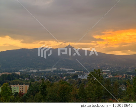mountain horizon with peaceful surroundings, serene mountain sunset over cityscape and hills mountain horizon with peaceful surroundings, serene mountain sunset over cityscape and hills 133058643