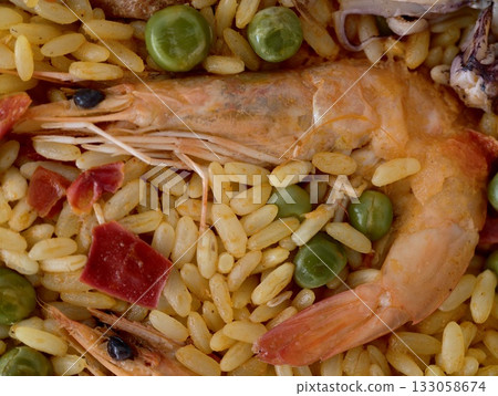 seafood and rice, intimate perspective showcasing fresh shrimp and aromatic seasoned saffron rice seafood and rice, intimate perspective showcasing fresh shrimp and aromatic seasoned saffron rice 133058674