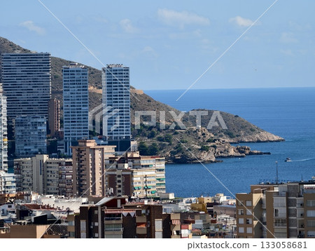 chic urban waterfront displays shimmering facades against peaceful bay landscape during bright chic urban waterfront displays shimmering facades against peaceful bay landscape during bright 133058681
