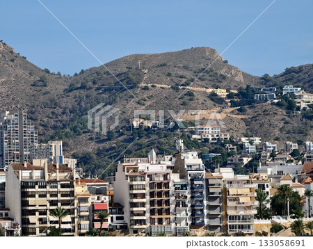 quiet residential area on hillside displaying blend of modern and traditional architecture 133058691