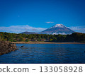A spectacular view of Mt. Fuji reflected in the clear blue autumn sky and the clear blue Lake Motosu 133058928