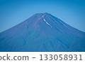 The summit of Mt. Fuji shines brightly on a clear early summer day, and the magnificent scenery of nature unfolds before your eyes. 133058931