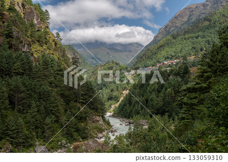 Dudh Koshi river flowing through the valley in Sagarmtha national park in Nepal. This national park is a UNESCO World Heritage Site in the Khumbu region of Nepal that is home to Mount Everest. Dudh Koshi river flowing through the valley in Sagarmtha national park in Nepal. This national park is a UNESCO World Heritage Site in the Khumbu region of Nepal that is home to Mount Everest. 133059310