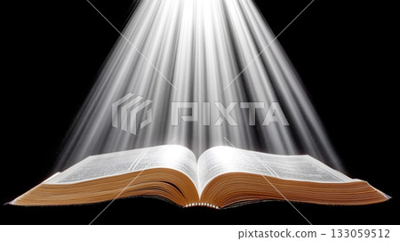 Open book radiating light with dramatic rays on black background 133059512