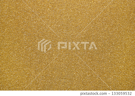 Golden glitter textured paper showing gleaming particles, suitable for festive, celebration, or luxurious concepts Golden glitter textured paper showing gleaming particles, suitable for festive, celebration, or luxurious concepts 133059532