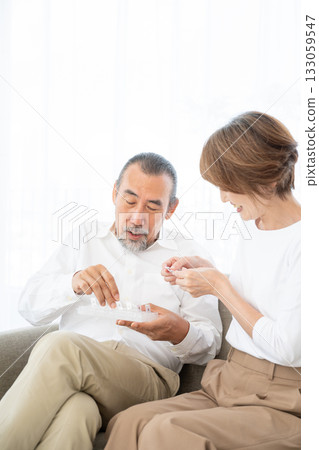 Senior men who take medicine 133059547