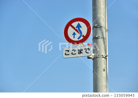 Road sign No overtaking sign and blue sky Road sign No overtaking sign and blue sky 133059945