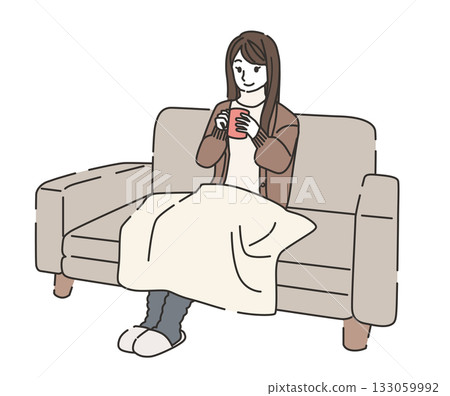 A woman warming herself with a blanket - an image of time spent at home A woman warming herself with a blanket - an image of time spent at home 133059992