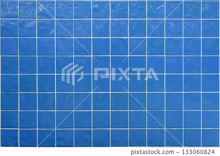 Blue ceramic tile background. Old vintage ceramic tiles in green to decorate the kitchen or bathroom Blue ceramic tile background. Old vintage ceramic tiles in green to decorate the kitchen or bathroom 133060824