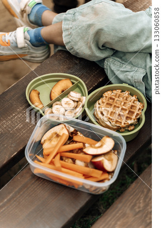 Healthy Kids Lunch Box Outdoors. Food snacks for children on the street. Healthy Kids Lunch Box Outdoors. Food snacks for children on the street. 133060858