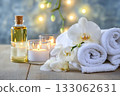 Beautiful spa composition. Couple Towels With Candles And Orchid For Natural Massage 133062631