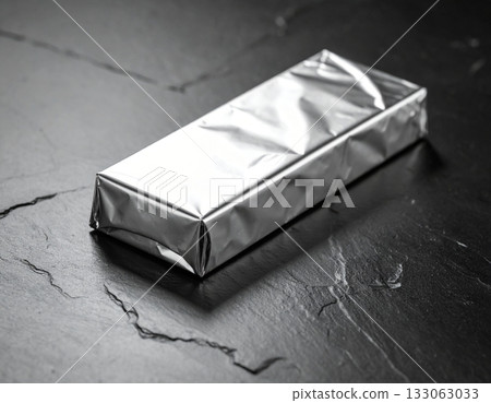 Metallic Bar Wrapper on Dark Background 133063033