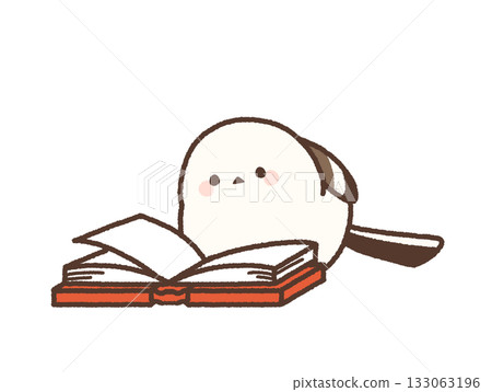 A long-tailed tit peering into an open book 133063196