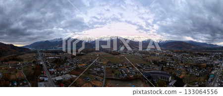 Three-tiered autumn foliage in Hakuba before sunrise, Hakuba Village, Nagano Prefecture (aerial shot by drone) Three-tiered autumn foliage in Hakuba before sunrise, Hakuba Village, Nagano Prefecture (aerial shot by drone) 133064556