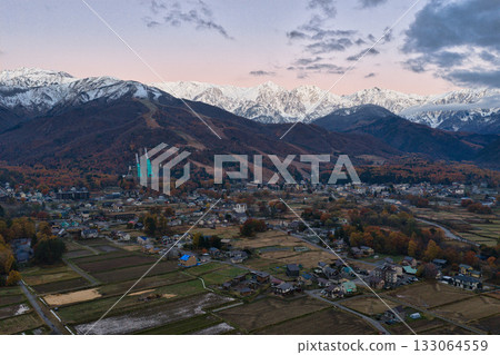 Three-tiered autumn foliage in Hakuba before sunrise, Hakuba Village, Nagano Prefecture (aerial shot by drone) Three-tiered autumn foliage in Hakuba before sunrise, Hakuba Village, Nagano Prefecture (aerial shot by drone) 133064559