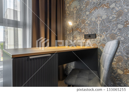 Modern Workspace Corner with Wooden Desk and Lamp Modern Workspace Corner with Wooden Desk and Lamp 133065255
