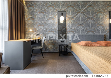 Modern Bedroom Interior with Work Desk and Warm Lighting 133065264