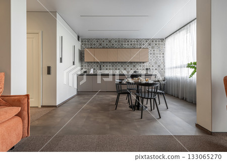 Bright Modern Kitchen with Patterned Wall Tiles and Black Furniture Bright Modern Kitchen with Patterned Wall Tiles and Black Furniture 133065270