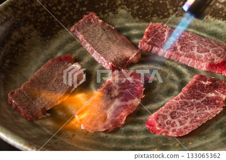 Grilled kalbi on a hot plate Grilled kalbi on a hot plate 133065362
